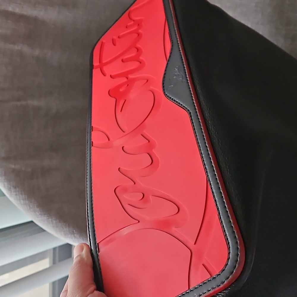 Sophisticated Black and Red Leather Tote with Stud Accents